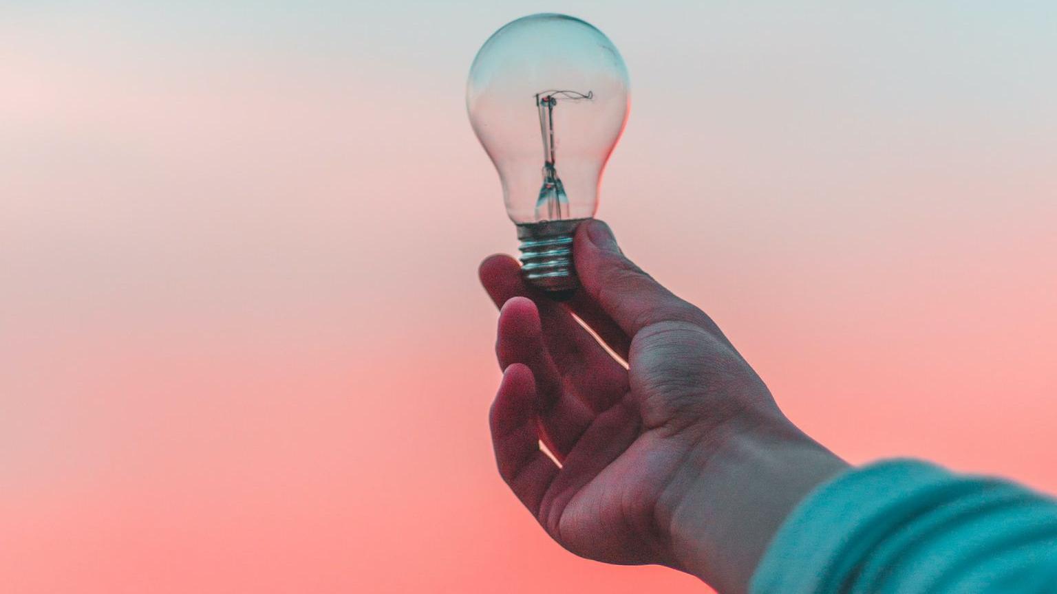 person holding light bulb